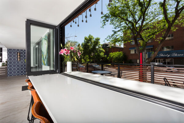 Bartop with sliding window overlooking street.
