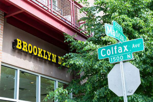 Detail of street sign at corner of Madison Street and Colfax.