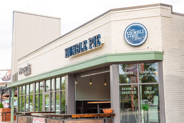 Humble Pie restaurant with patio and garage door.