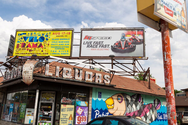 Monroe Liquors with retro signage and fish mural.