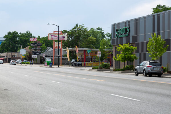 Colfax Avenue with Sprouts farmers market, Steve's snappin dogs, and Bastiens restaurant.