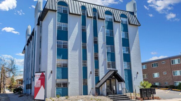 10 S Penn apartments with classic grey brick construction and ample parking.