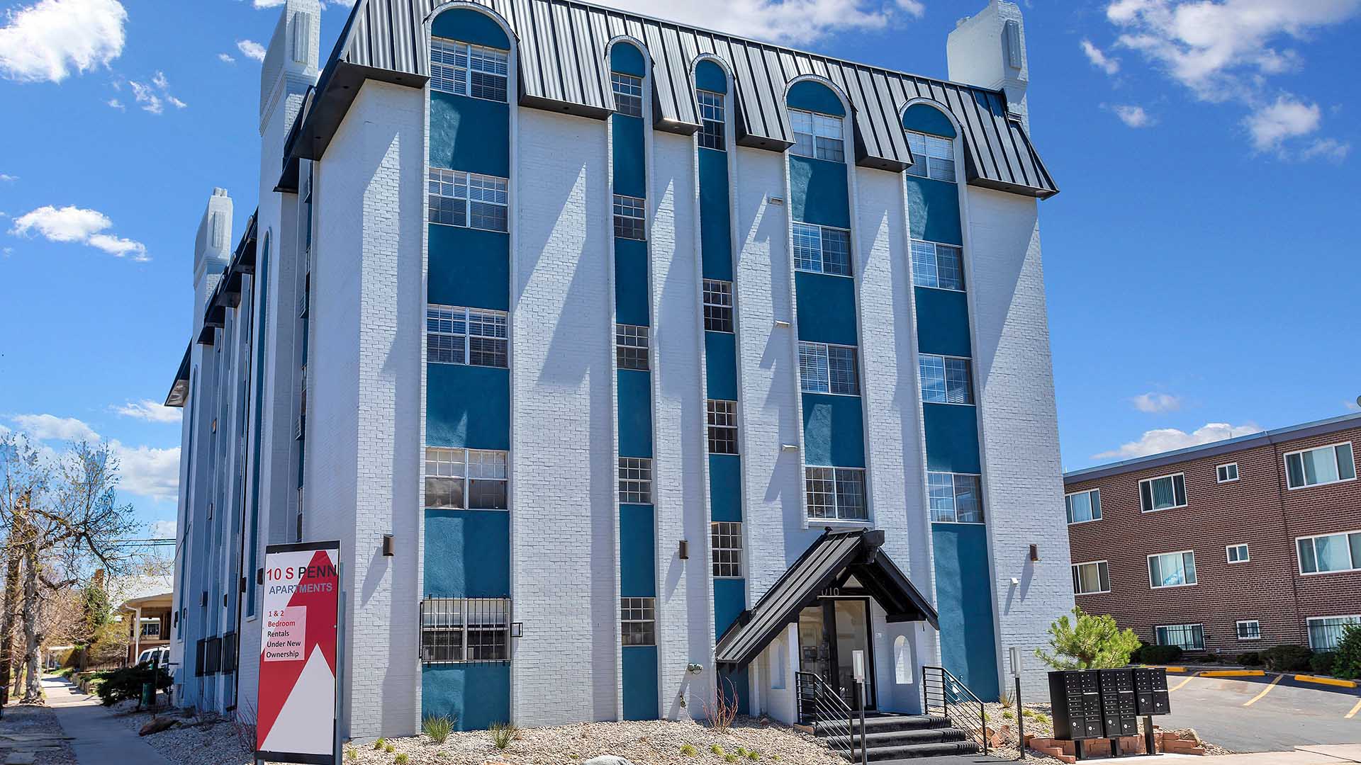 10 S Penn apartments with classic grey brick construction and ample parking.