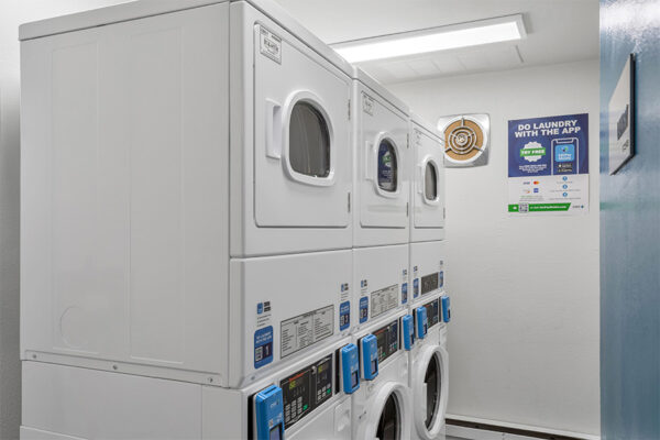 Laundry room with washers and dryers.