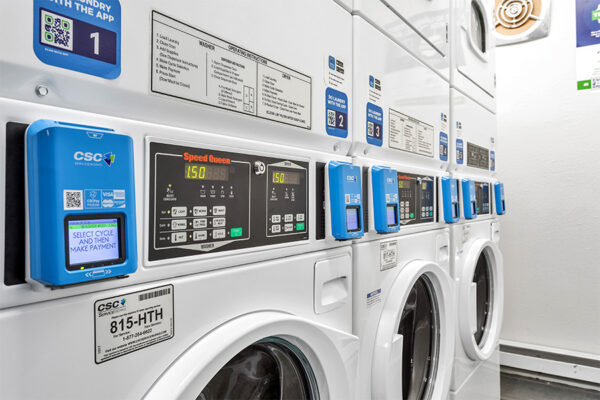 Laundry room with washers and dryers.