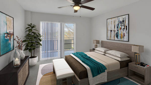 Bedroom with platform bed, bedside tables with lamps, and balcony door.