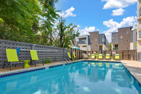 1190 Birch pool area with clean blue water and lounge chairs.