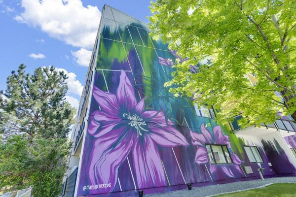 1190 Birch apartments with colorful floral mural.