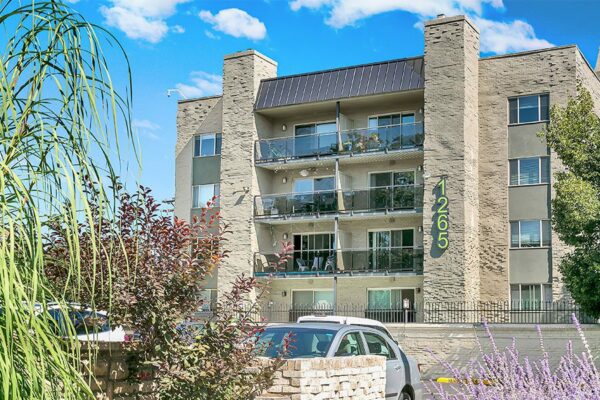 1265 Downing apartments with brick construction and large balconies.