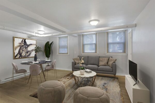 1357 & 1373 Cook living room with plush couch, large TV, and dining table.