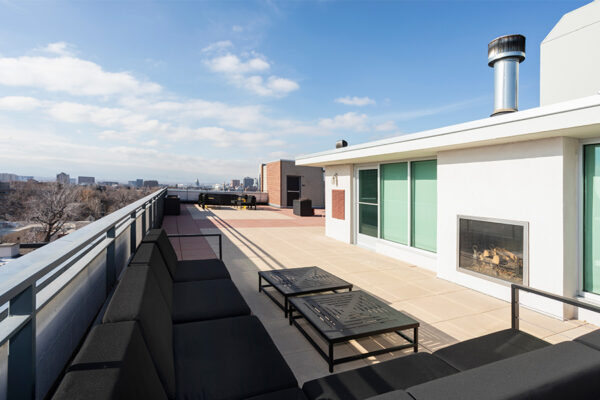 Rooftop patio with plush outdoor sectional overlooking Denver.