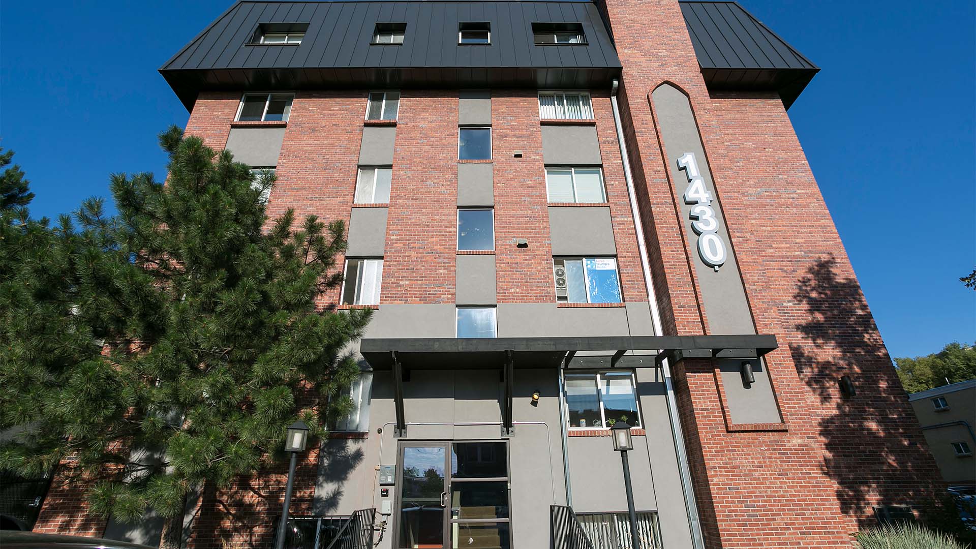 1430 Humboldt apartment building with brick construction and monument signage.