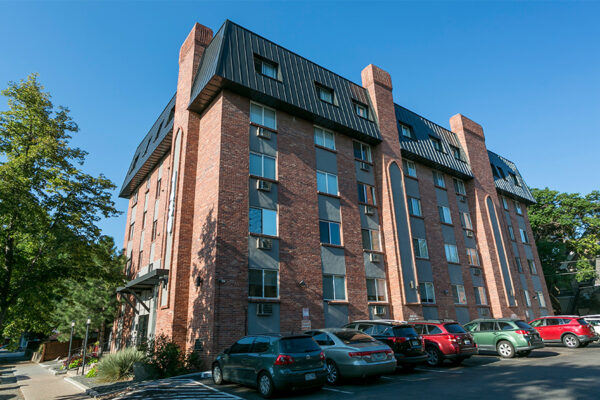 1430 Humboldt building with brick construction, large windows, and ample parking.