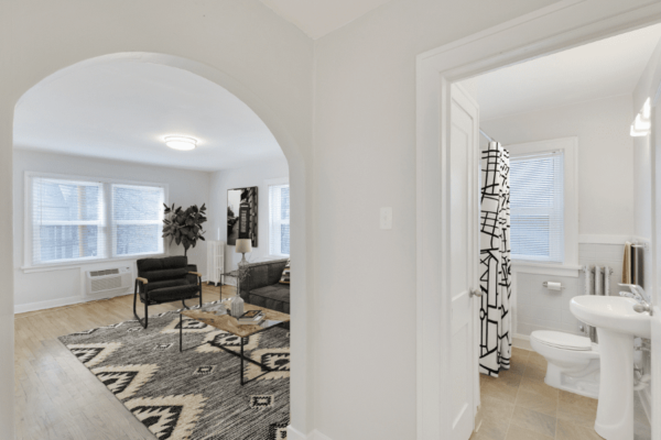 view looking into both living room and bathroom