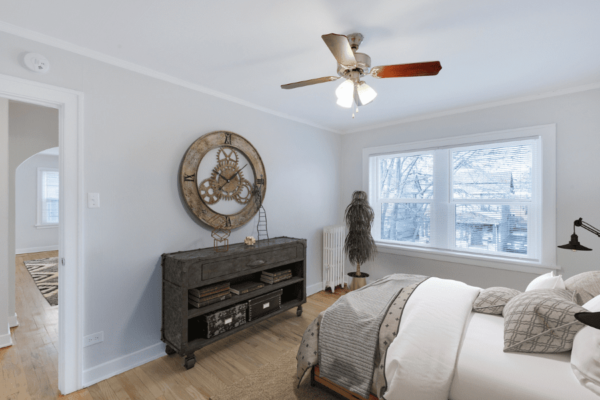 bedroom with large night stand and window with a view looking out to the living room