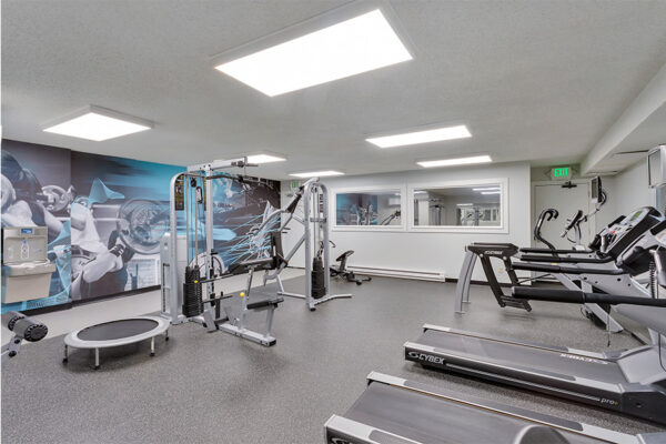 Fitness center with weight equipment and cardio machines.