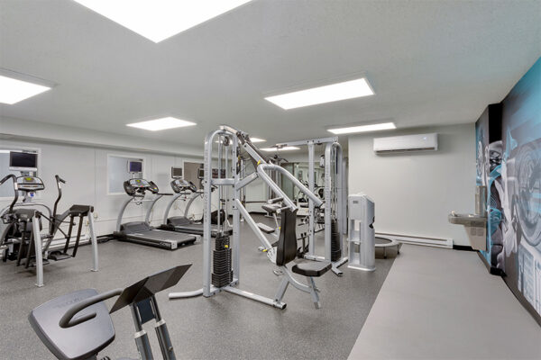 Fitness center with weight equipment and cardio machines.