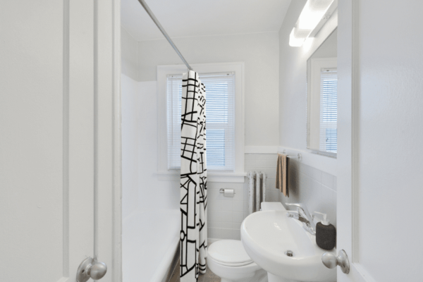 bathroom with a view of sink and bathtub