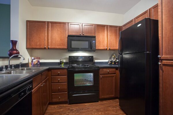 Kitchen and dining room with wood cabinets.