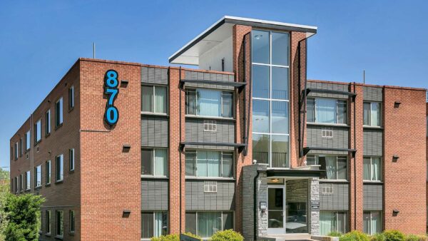 870 Cherry apartments with classic brick construction and glass entryway.