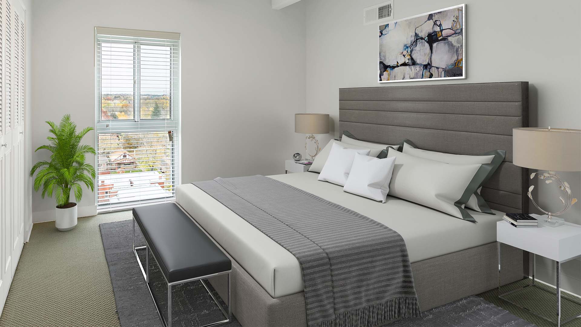 Bedroom with plush bed, bedside tables with lamps, and large window.