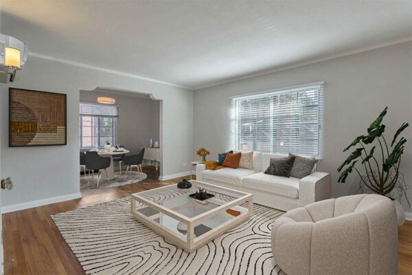 Living room with plush seating, modern furniture, and artwork.