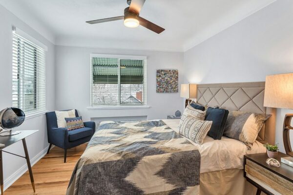 bedroom with decor and natural light and ceiling fan