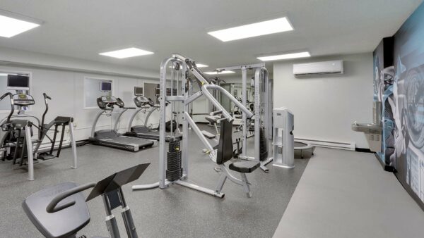 Fitness center with weight equipment and cardio machines.