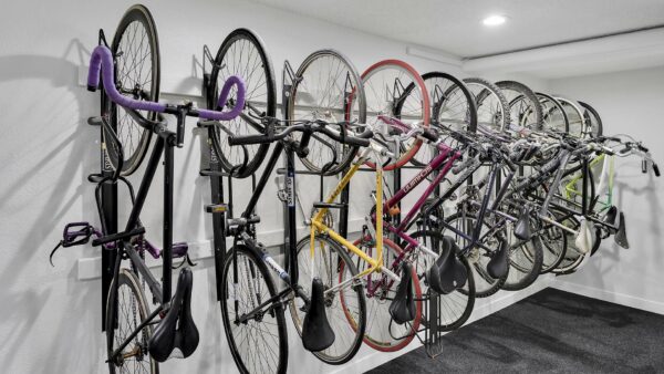 Bike storage room with bike hanging rack.