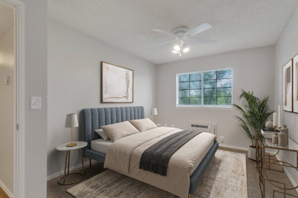 bedroom with large bed, window and ceiling fan