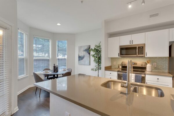 Kitchen with island and dining area.