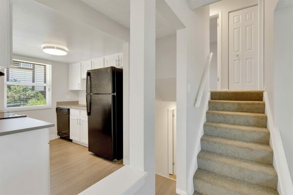 Stairway to bedrooms, overlooking kitchen.