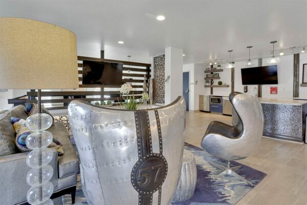 Seating area in clubhouse at 515 Clarkson with a television.