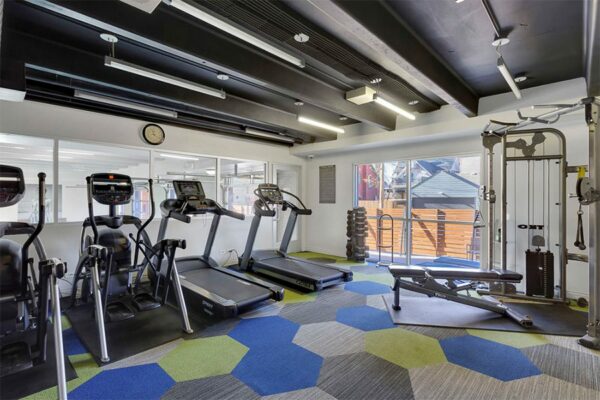 Fitness center at 515 Clarkson with cardio machines.