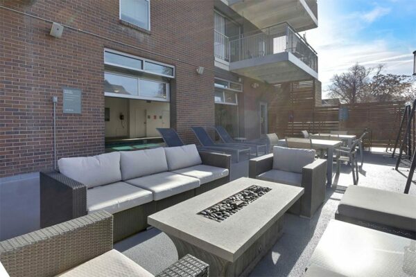 Outdoor patio at 515 Clarkson with seating areas and a fire place.