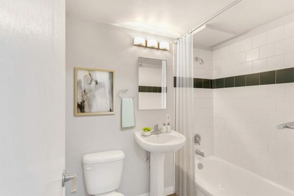 IMage of bathroom with clean decor and shower and vanity in 870 Cherry