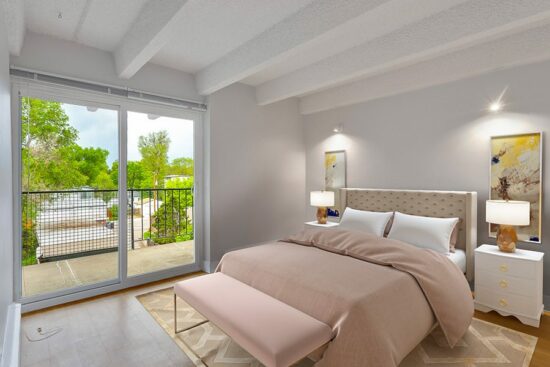 Rendering of a bedroom with a door to the patio, white walls, and a plush bed.