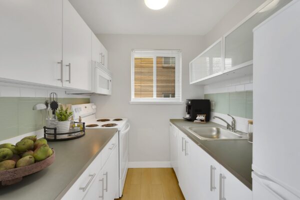 kitchen with parallel counters, sink on the right side and window