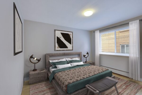 one bedroom apartment bedroom with bed in middle of room and large window