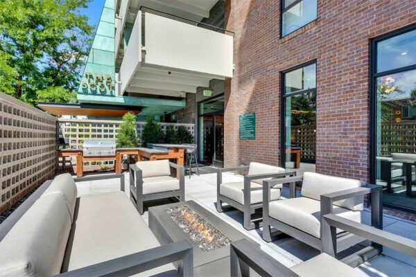 Outdoor lounge with BBQ grill and bar top.