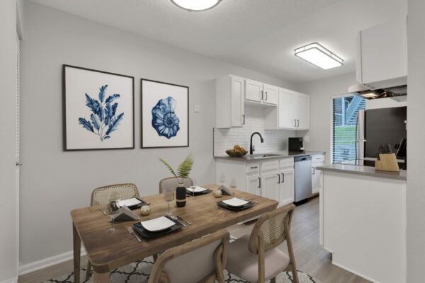 Kitchen with upgraded fetaures, faux wood floors and stainless steel appliances.