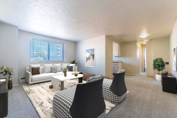 living room with tv, couches facing each other, hallway to kitchen and bedroom