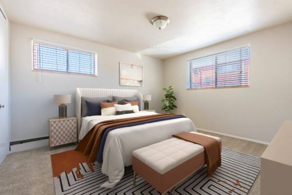 bedroom with king sixed bed, two windows, dresser, and night stands