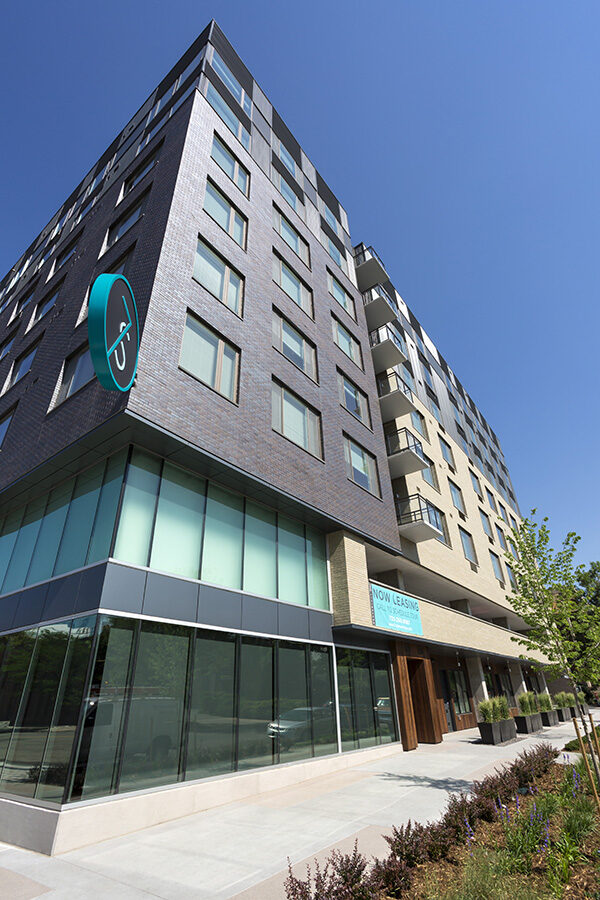 7 S Denver Haus building exterior with modern architecture and apartment balconies.