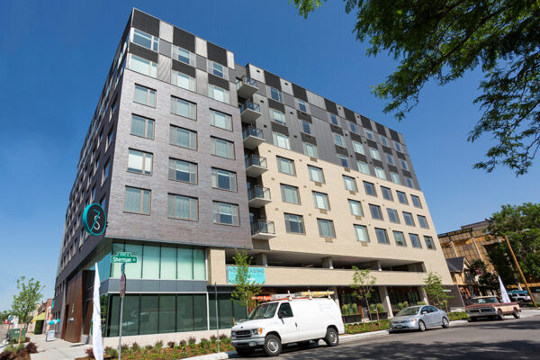 7 S Denver Haus building exterior with modern architecture and apartment balconies.