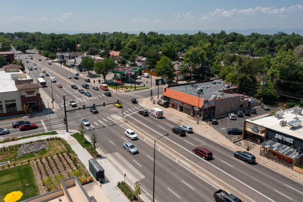 Aerial view of restaurants, gas stations, and Trader Joe's nearby.