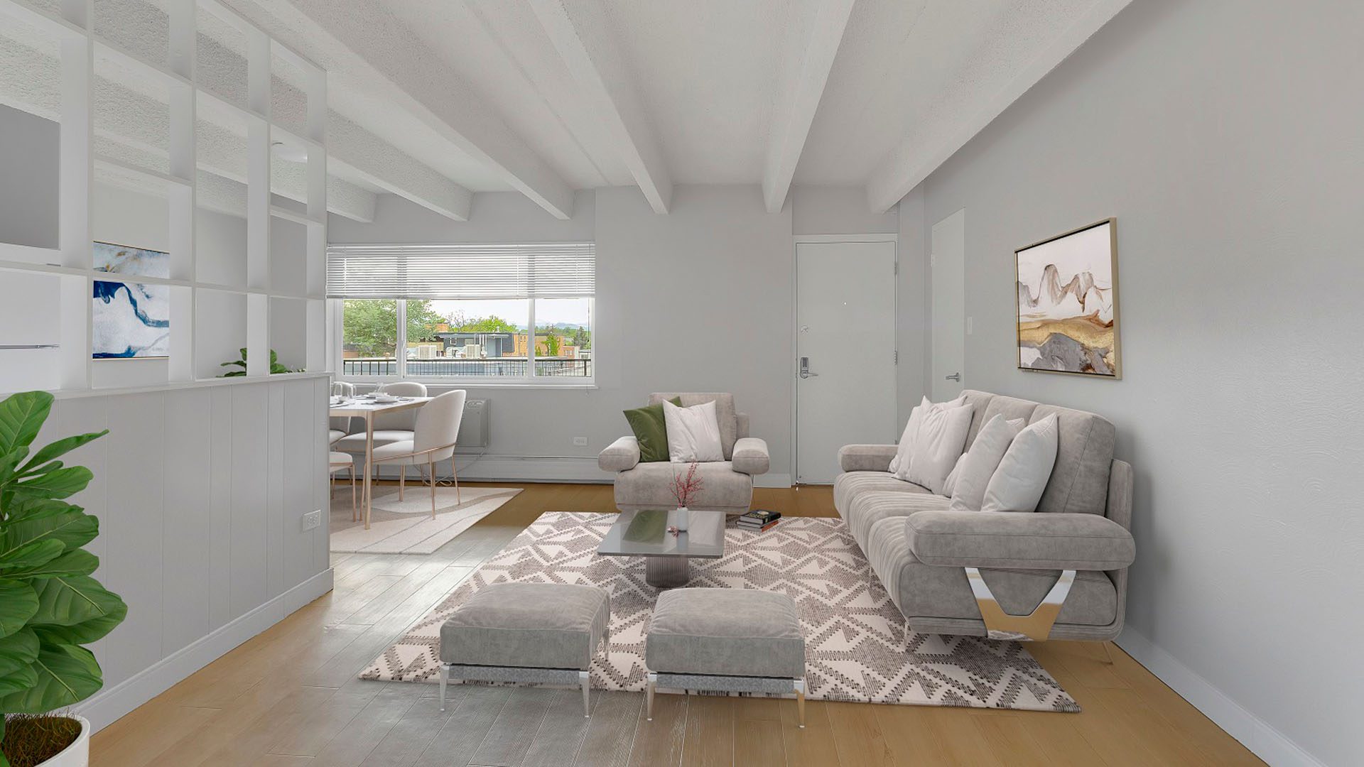 Living room with wood floor, plush rug, comfortable seating, and dining table.