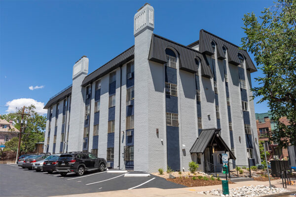 899 Washington building exterior with ample parking and classic construction.