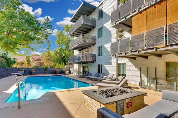 950 Lafayette pool area with fireplace and chairs.