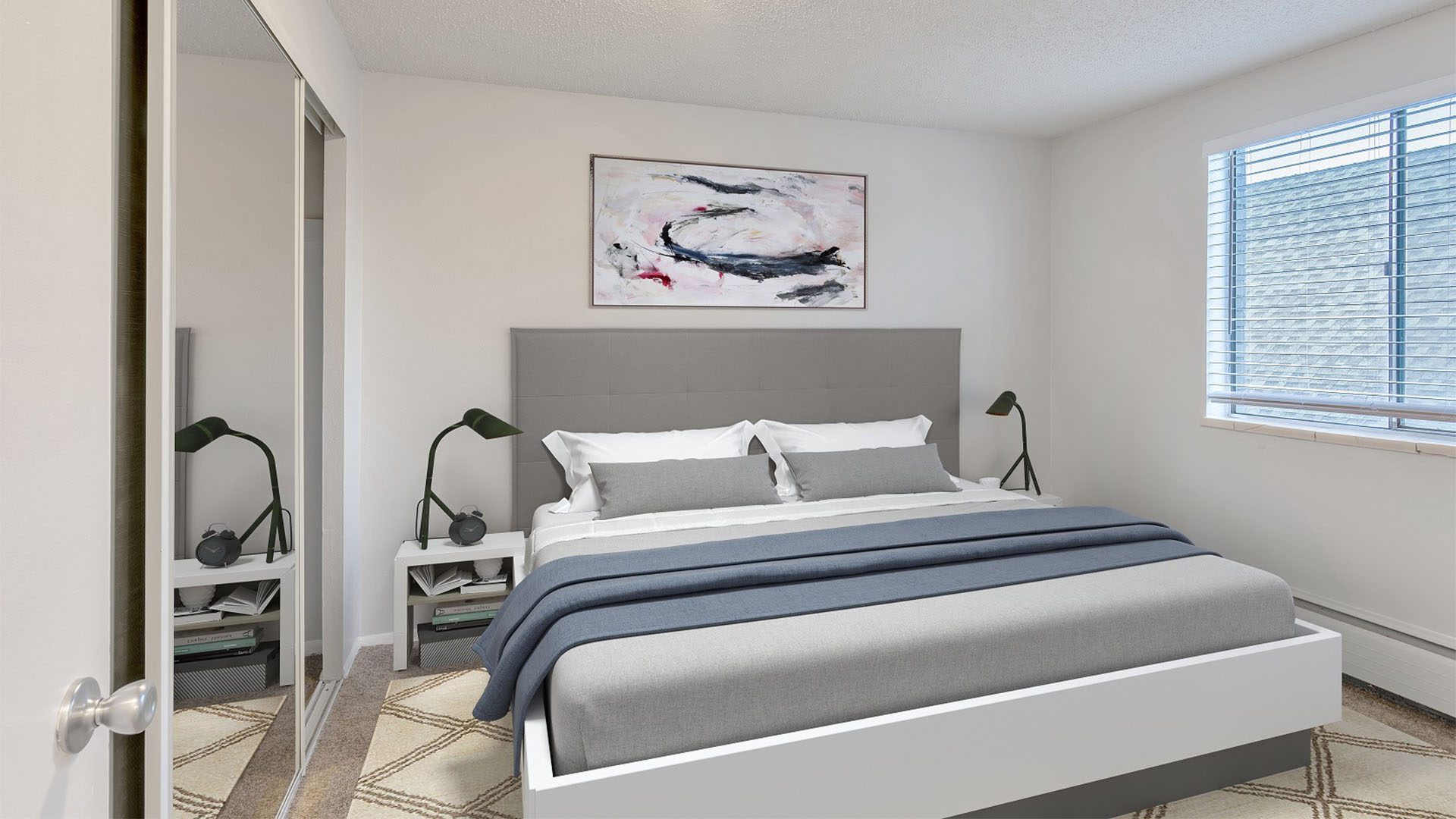 Bedroom with platform bed, bedside tables with lamps, and large window.